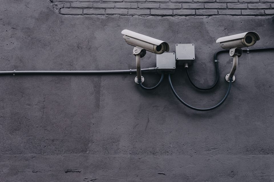 Two security cameras stay vigilant.