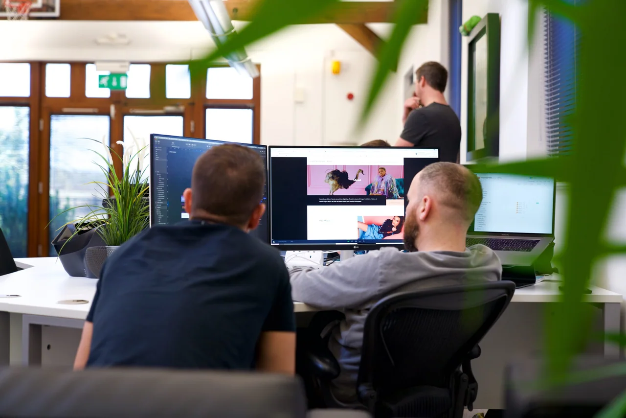 The Code23 team working together in the office